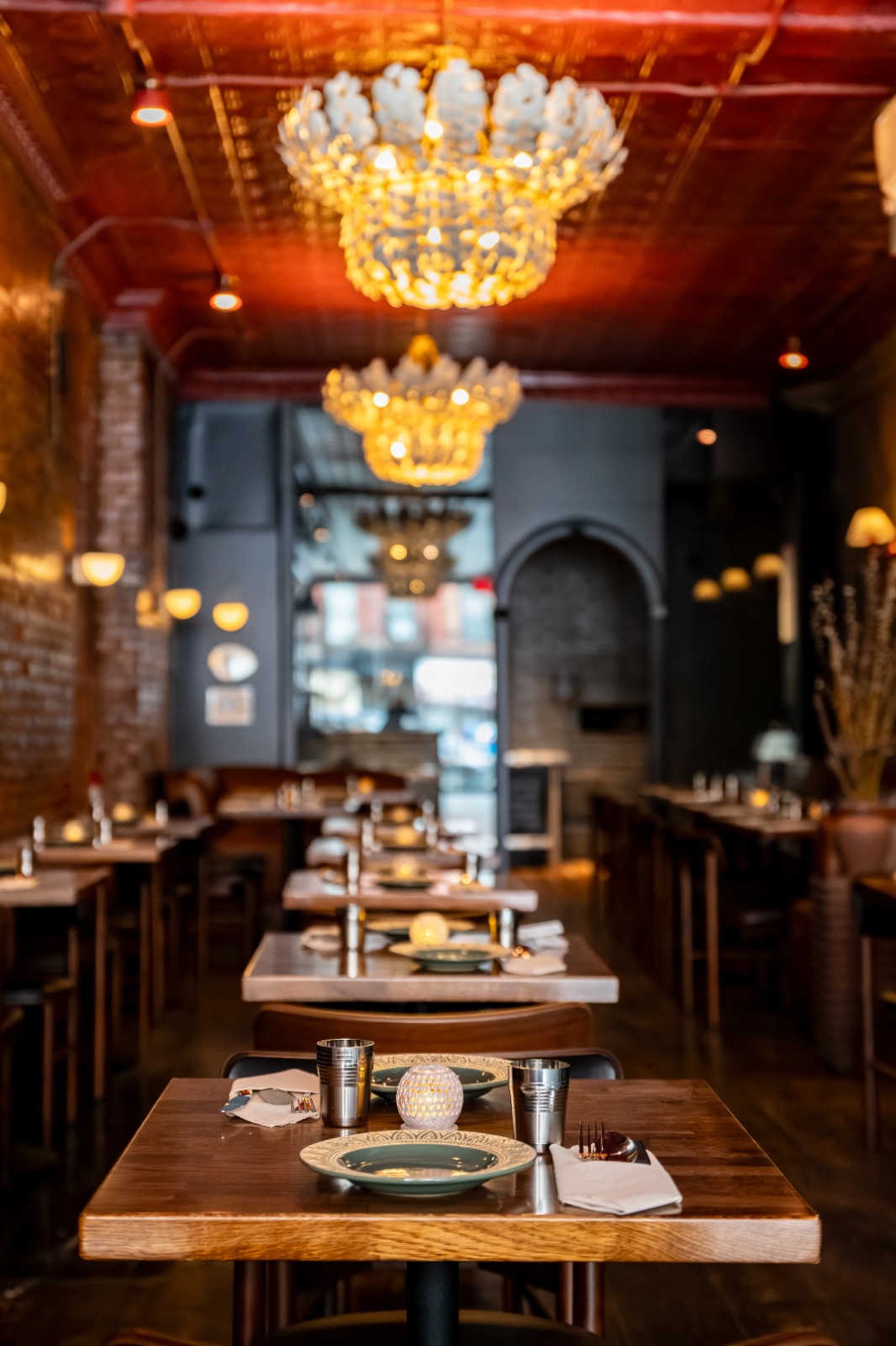 Coconut shell chandeliers above dining tables