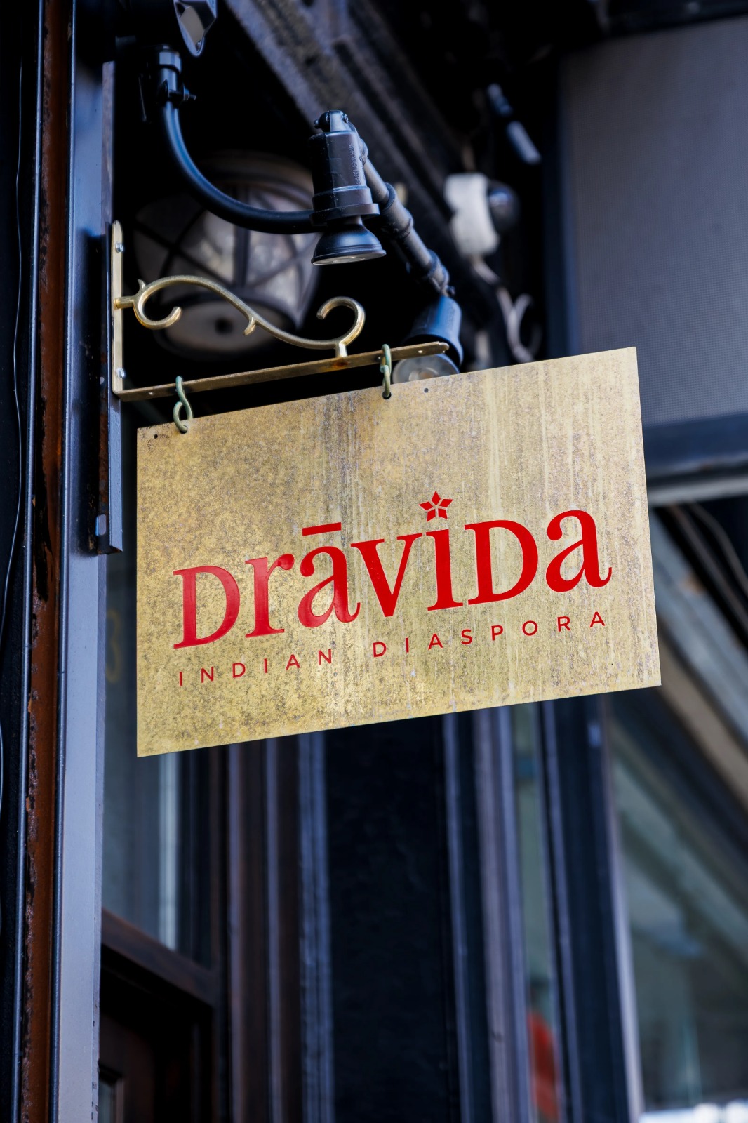 Dravida outdoor signage in gold
